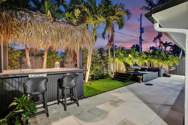 patio terrace at dusk with exterior bar