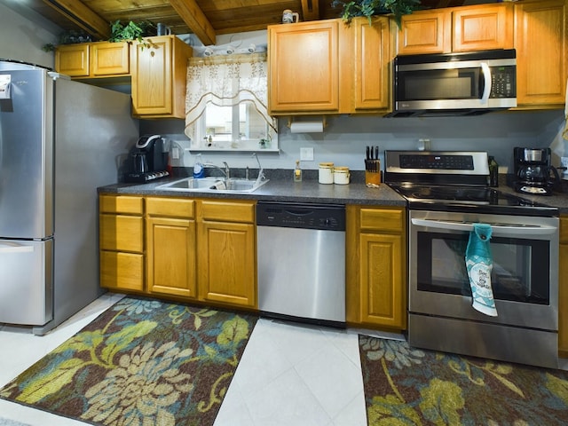 kitchen with beam ceiling, sink, stainless steel appliances, and wooden ceiling