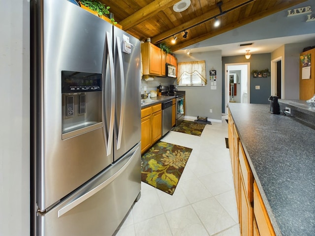 kitchen with wooden ceiling, stainless steel appliances, track lighting, and lofted ceiling with beams