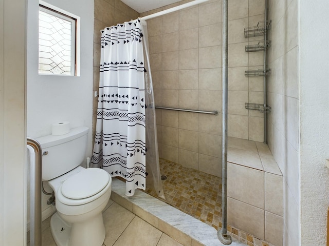 bathroom featuring a shower with curtain, toilet, and tile patterned floors