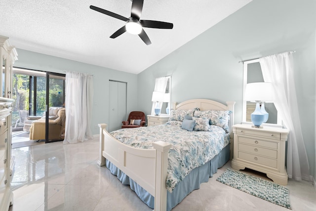 bedroom with vaulted ceiling, access to outside, ceiling fan, a textured ceiling, and a closet