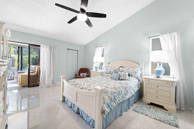 bedroom featuring access to outside, a closet, a textured ceiling, a ceiling fan, and lofted ceiling