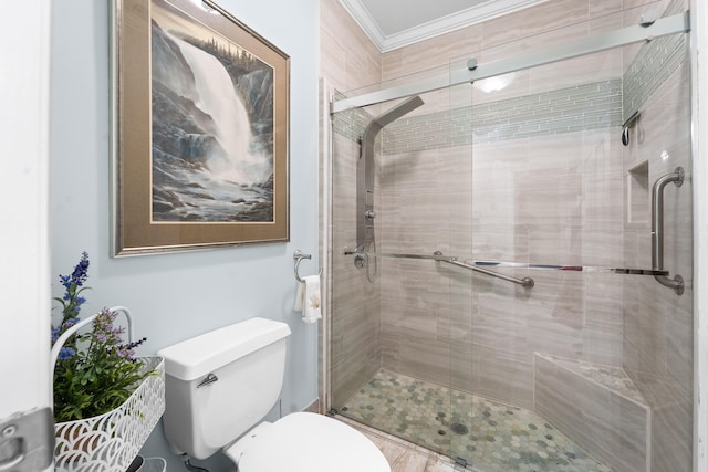 bathroom featuring toilet, crown molding, and a stall shower
