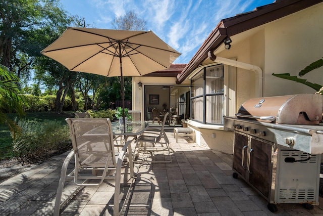 view of patio / terrace featuring grilling area, an outdoor kitchen, and outdoor dining area