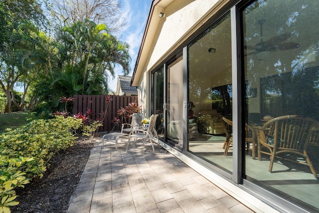 view of patio featuring fence