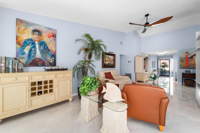 living room with ceiling fan, lofted ceiling, and a textured ceiling