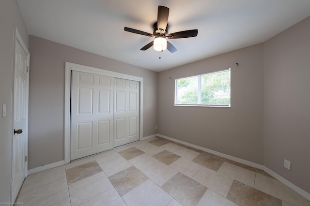 unfurnished bedroom featuring a closet and ceiling fan