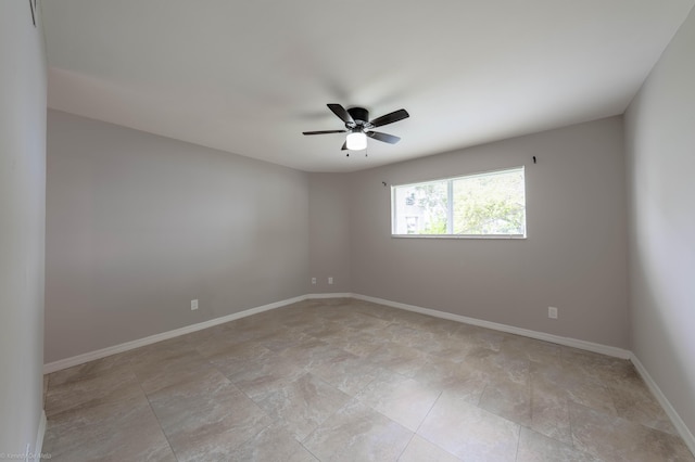 spare room with ceiling fan