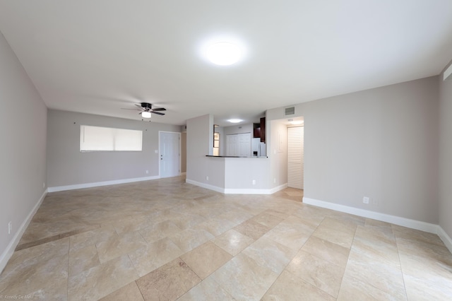 unfurnished living room with ceiling fan