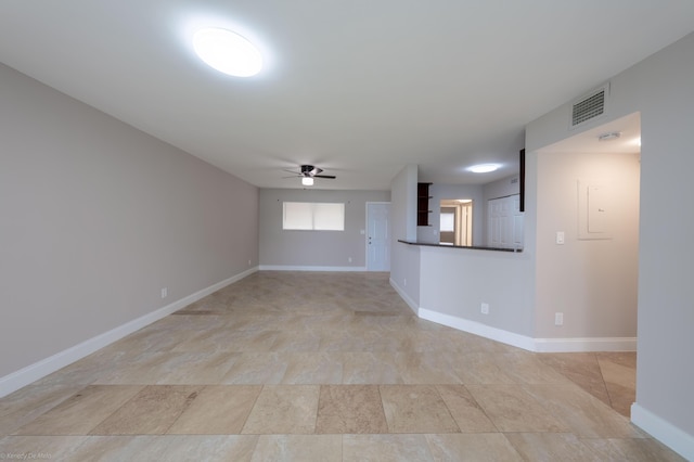 unfurnished living room featuring ceiling fan