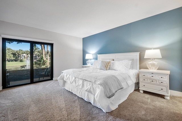 bedroom featuring light carpet and access to exterior