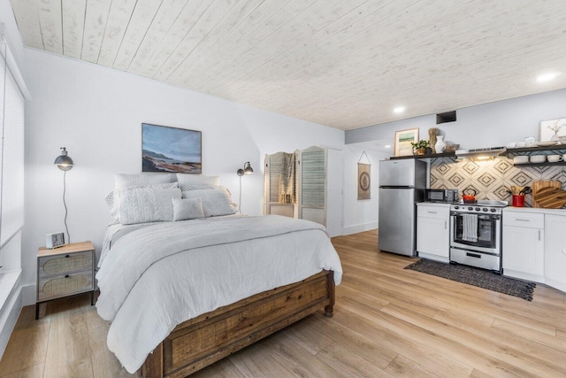 bedroom with wood ceiling, stainless steel fridge, and light hardwood / wood-style floors