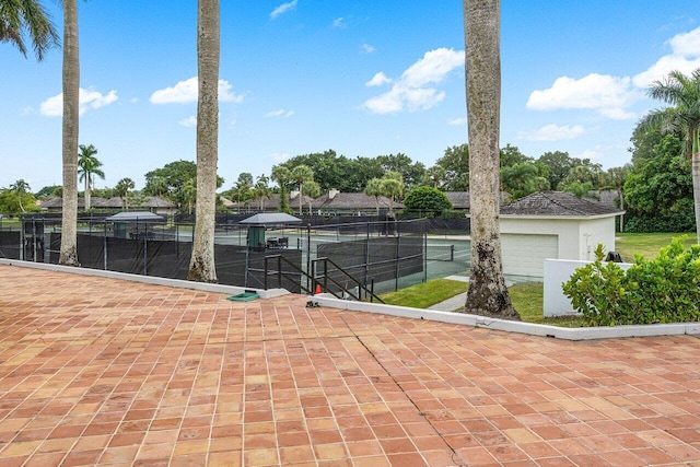 view of patio featuring tennis court