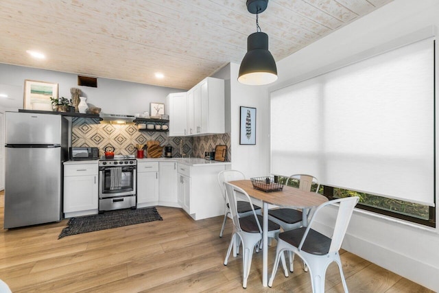 kitchen with pendant lighting, wood ceiling, stainless steel appliances, light hardwood / wood-style floors, and white cabinets