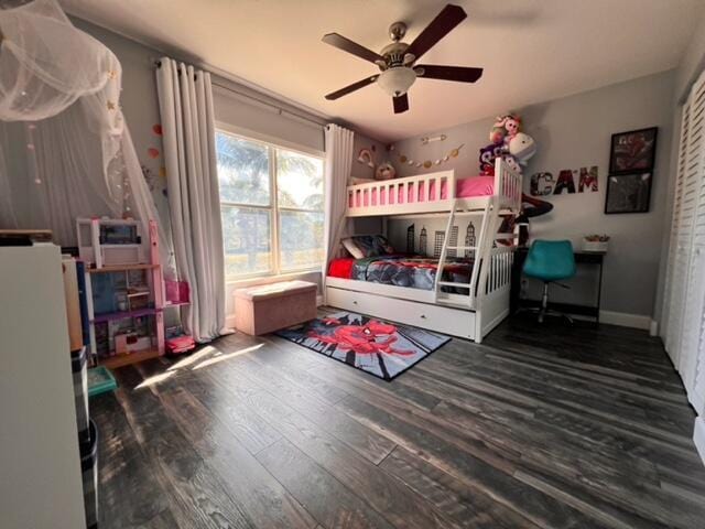 bedroom featuring white refrigerator, dark hardwood / wood-style floors, and ceiling fan