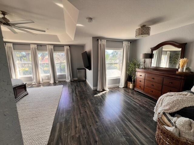 bedroom featuring dark wood-type flooring and ceiling fan