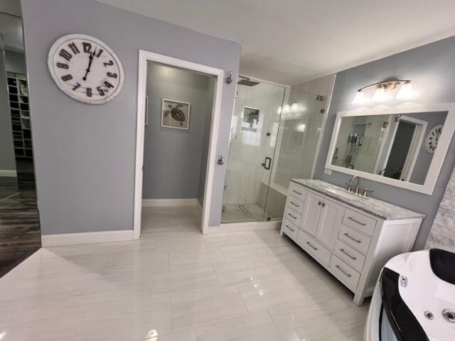 bathroom featuring vanity and walk in shower