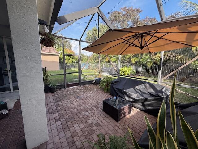 view of patio with a lanai