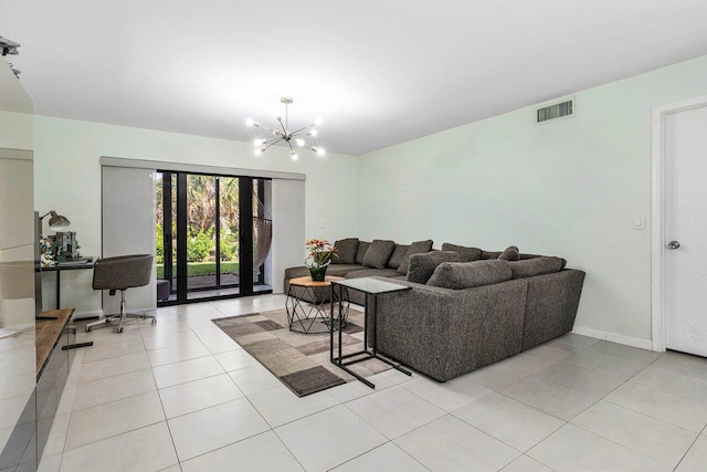 tiled living room featuring a chandelier