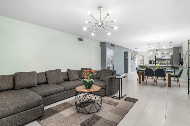 living room featuring an inviting chandelier and light tile patterned floors