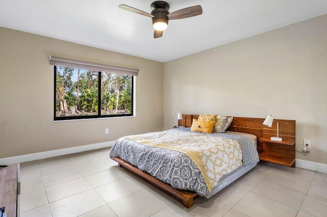 tiled bedroom with ceiling fan