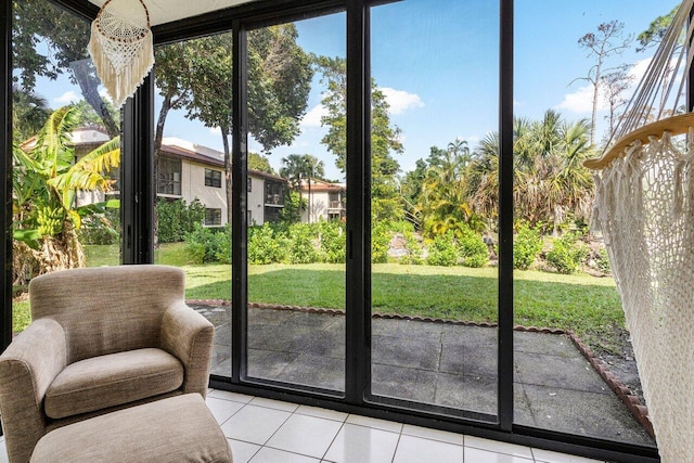 entryway featuring light tile patterned floors and expansive windows