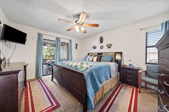 bedroom with ceiling fan, light colored carpet, multiple windows, and access to outside