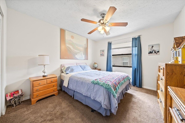 carpeted bedroom featuring a textured ceiling and ceiling fan