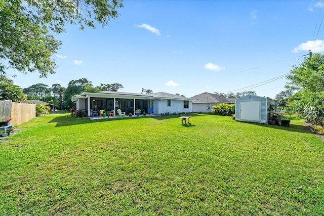 view of yard with a patio and a storage unit