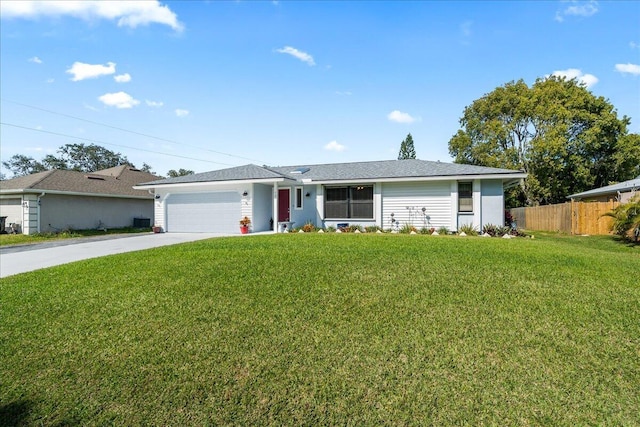 ranch-style home with a garage, a front yard, and cooling unit