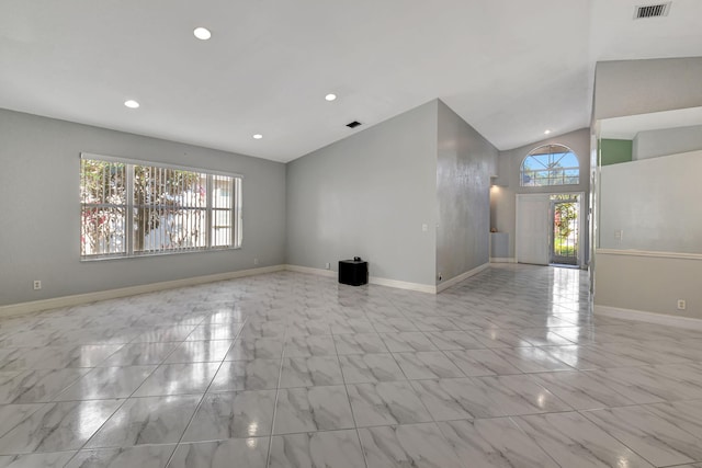 unfurnished living room with vaulted ceiling, recessed lighting, baseboards, and visible vents