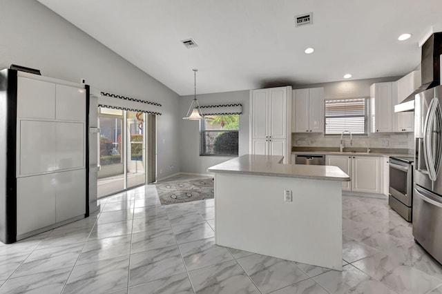 kitchen featuring visible vents, marble finish floor, appliances with stainless steel finishes, and vaulted ceiling