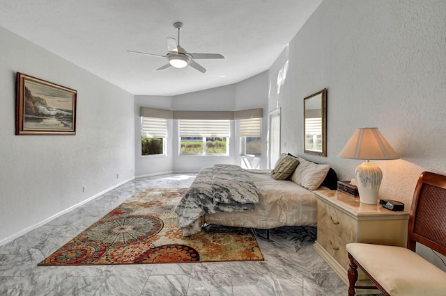 bedroom with baseboards, ceiling fan, lofted ceiling, a textured wall, and marble finish floor