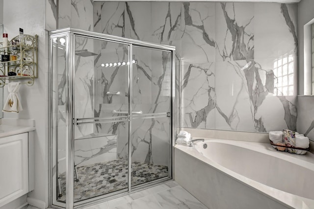 full bath featuring a bath, marble finish floor, and a marble finish shower