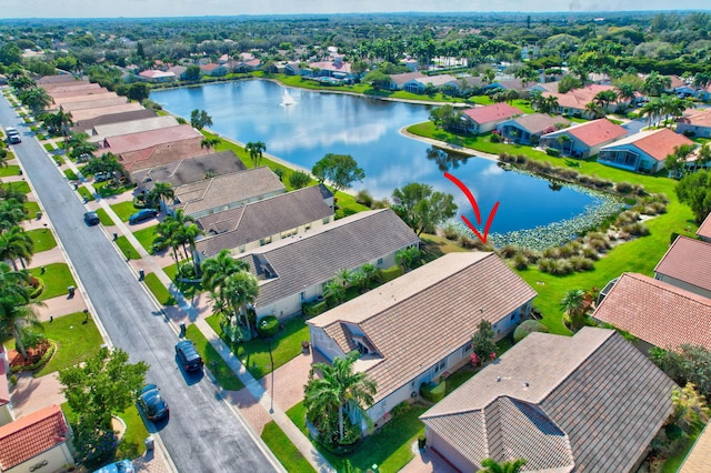 birds eye view of property featuring a residential view and a water view