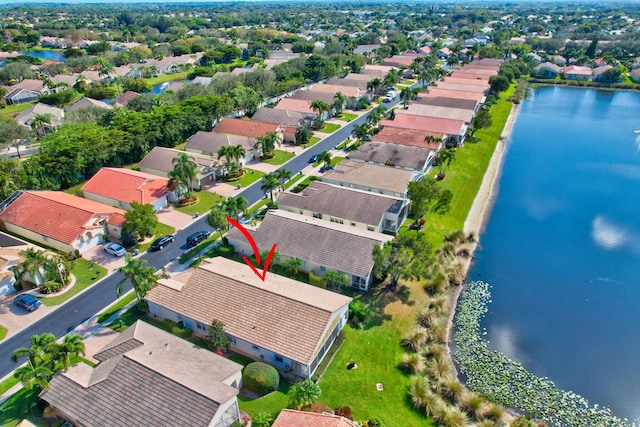 bird's eye view featuring a residential view and a water view