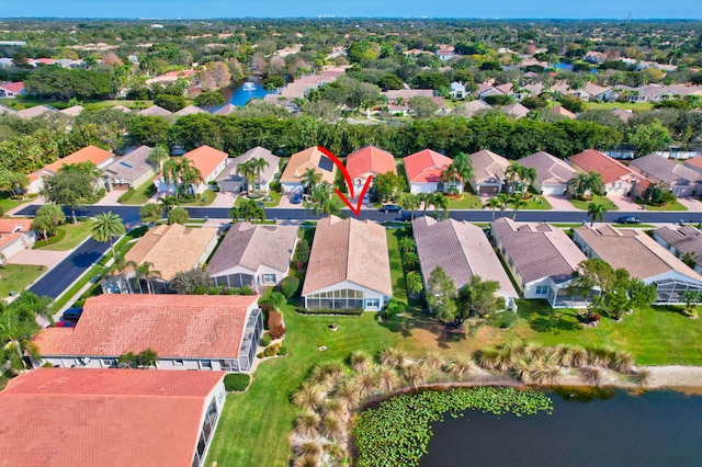 birds eye view of property with a residential view and a water view