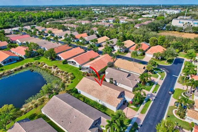 bird's eye view featuring a residential view and a water view