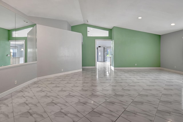 unfurnished room featuring recessed lighting, baseboards, and vaulted ceiling