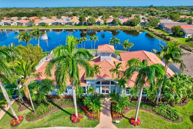 aerial view with a residential view and a water view