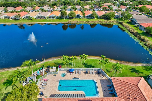 birds eye view of property featuring a residential view and a water view