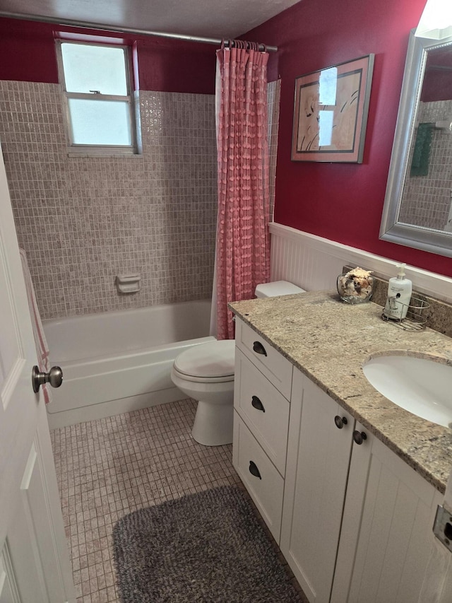 full bathroom with tile patterned flooring, vanity, shower / bath combination with curtain, and toilet