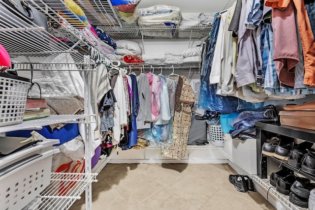 spacious closet featuring tile patterned floors