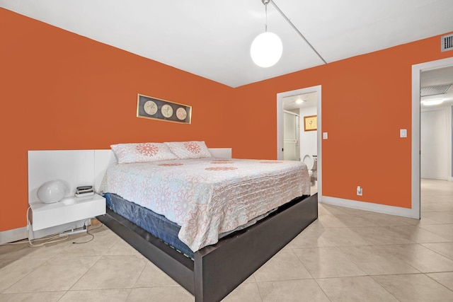 bedroom with light tile patterned flooring