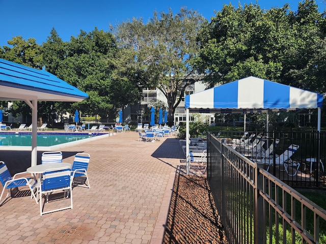 view of swimming pool with a patio area