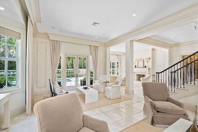 living room with ornamental molding, light tile patterned flooring, and french doors