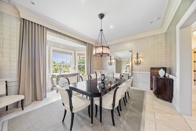 dining room with crown molding and a notable chandelier