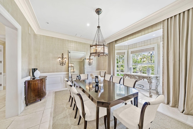 dining area with a chandelier and ornamental molding