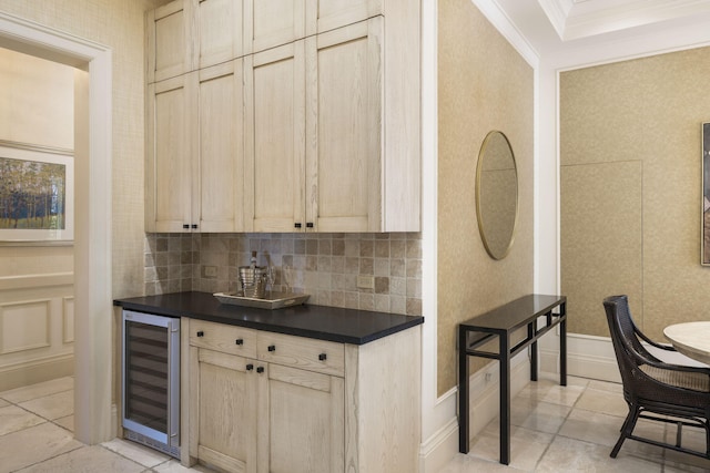 kitchen with light brown cabinets, decorative backsplash, wine cooler, and ornamental molding