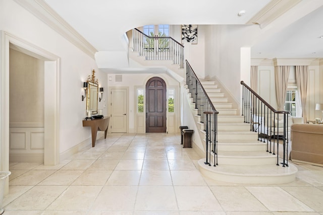 entryway featuring ornamental molding